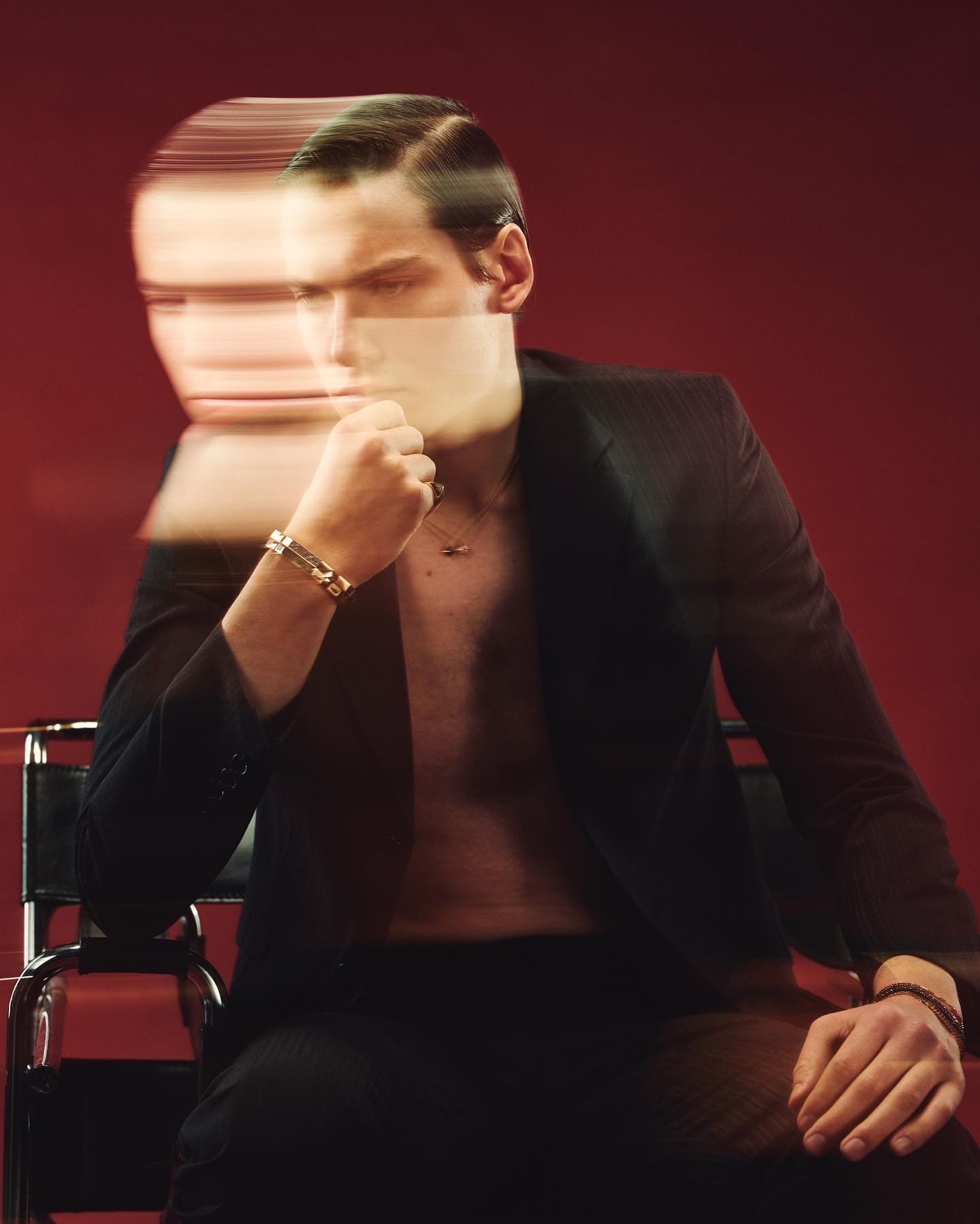 A ghosted long exposure closes Dime Tribe's lookbook, gold link bracelet steady at the chin.