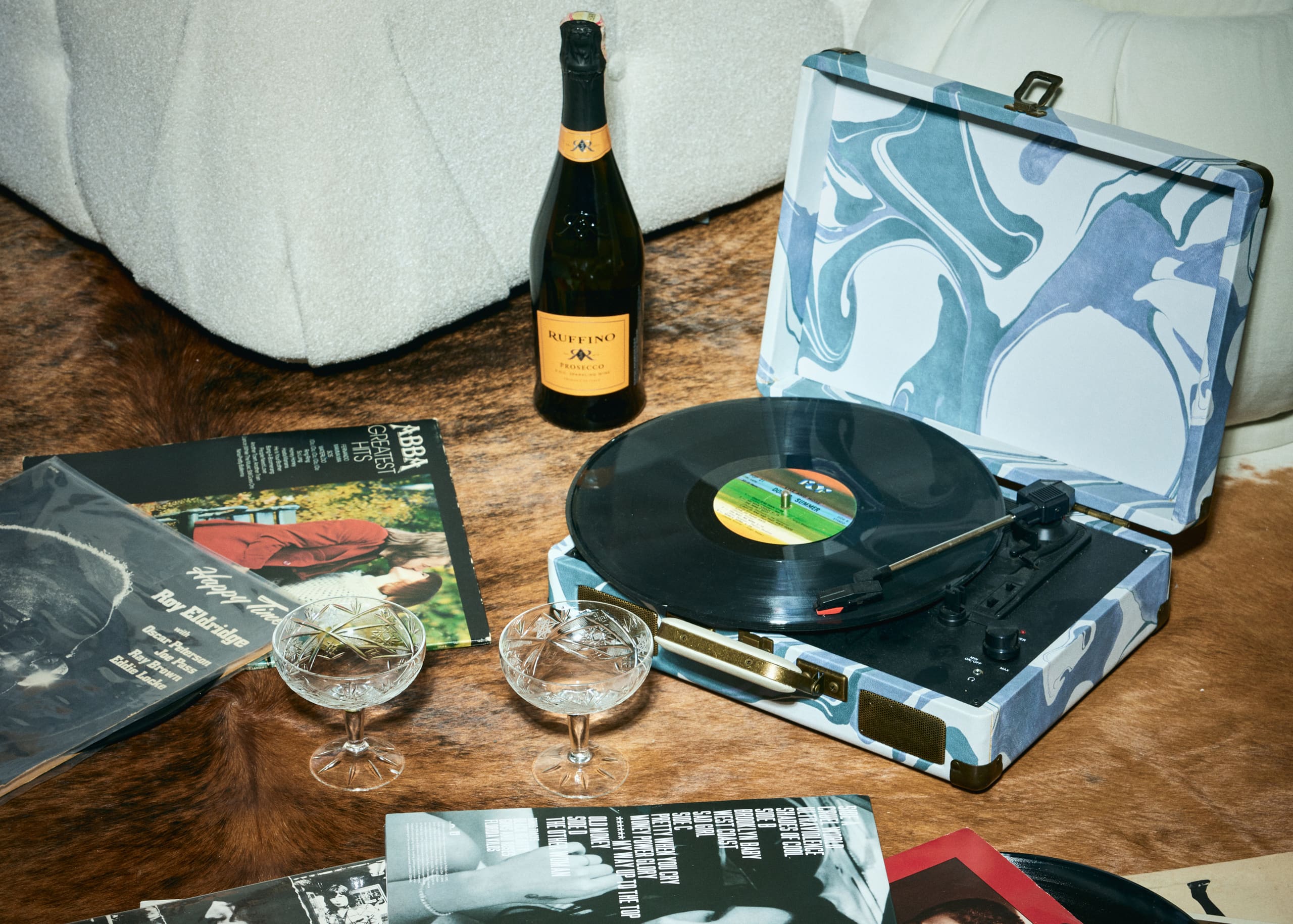 Prosecco, stacked records and a marbled turntable on cowhide set the after-hours tempo for Mers Silk.