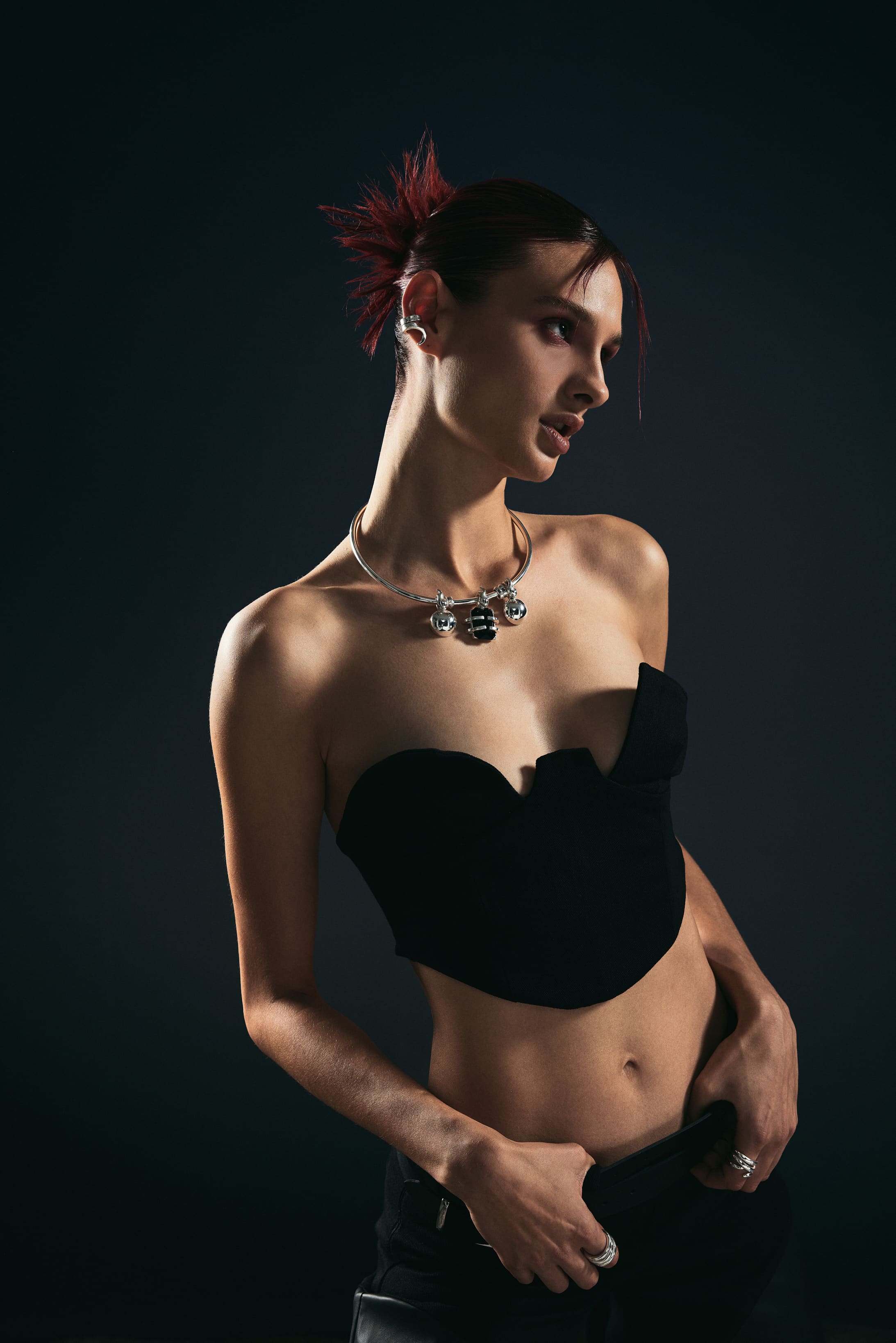 A silver charm choker and sweetheart bustier catch the light in a close Mysamoon portrait.