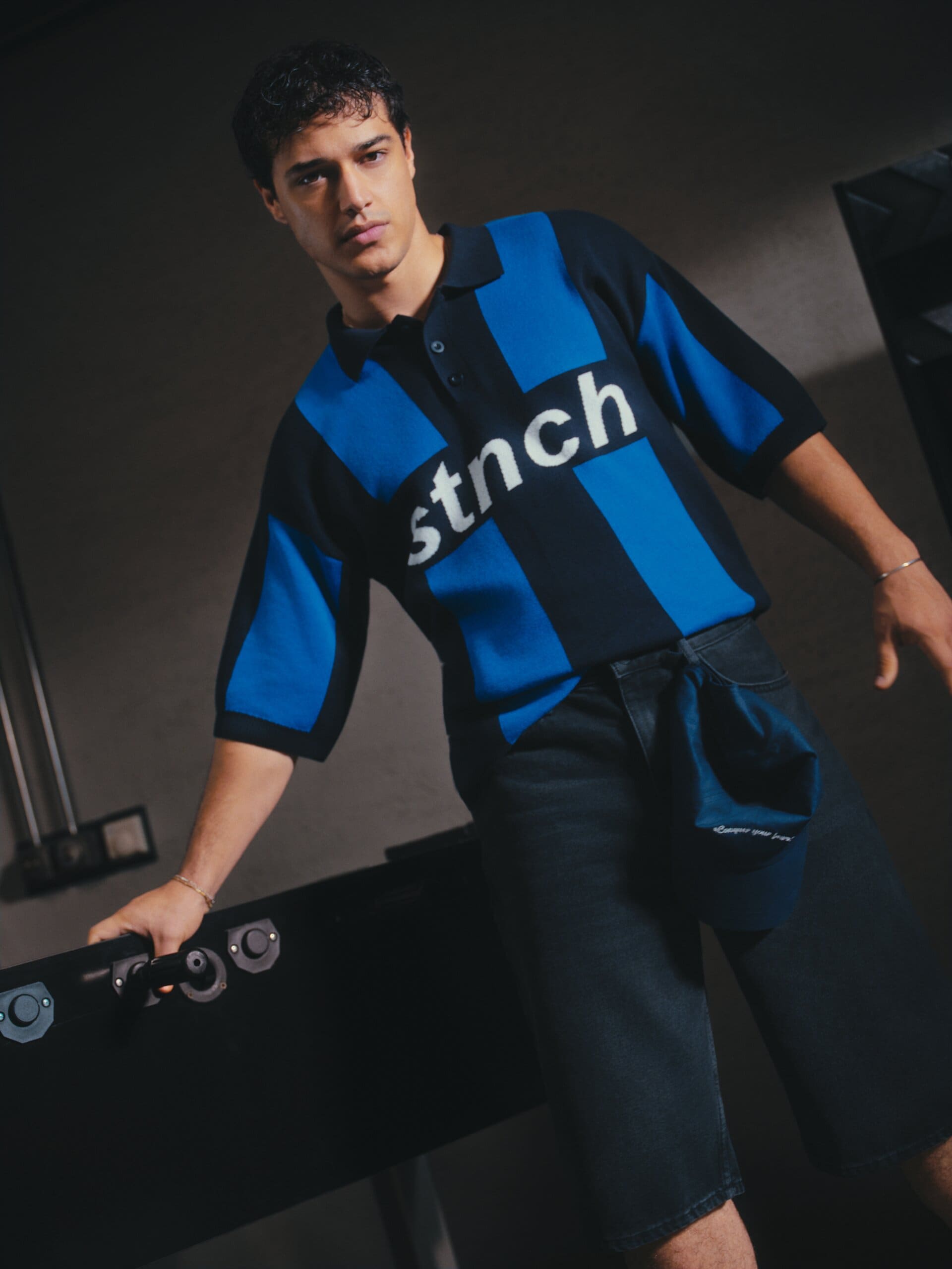 The camera cants as Kaan Miraç Sezen stares it down across the foosball table for XSIDE.